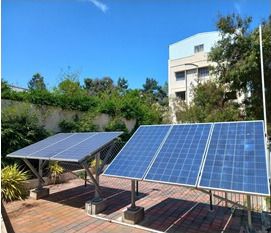 Photovoltaic panels on frames in the campus grounds