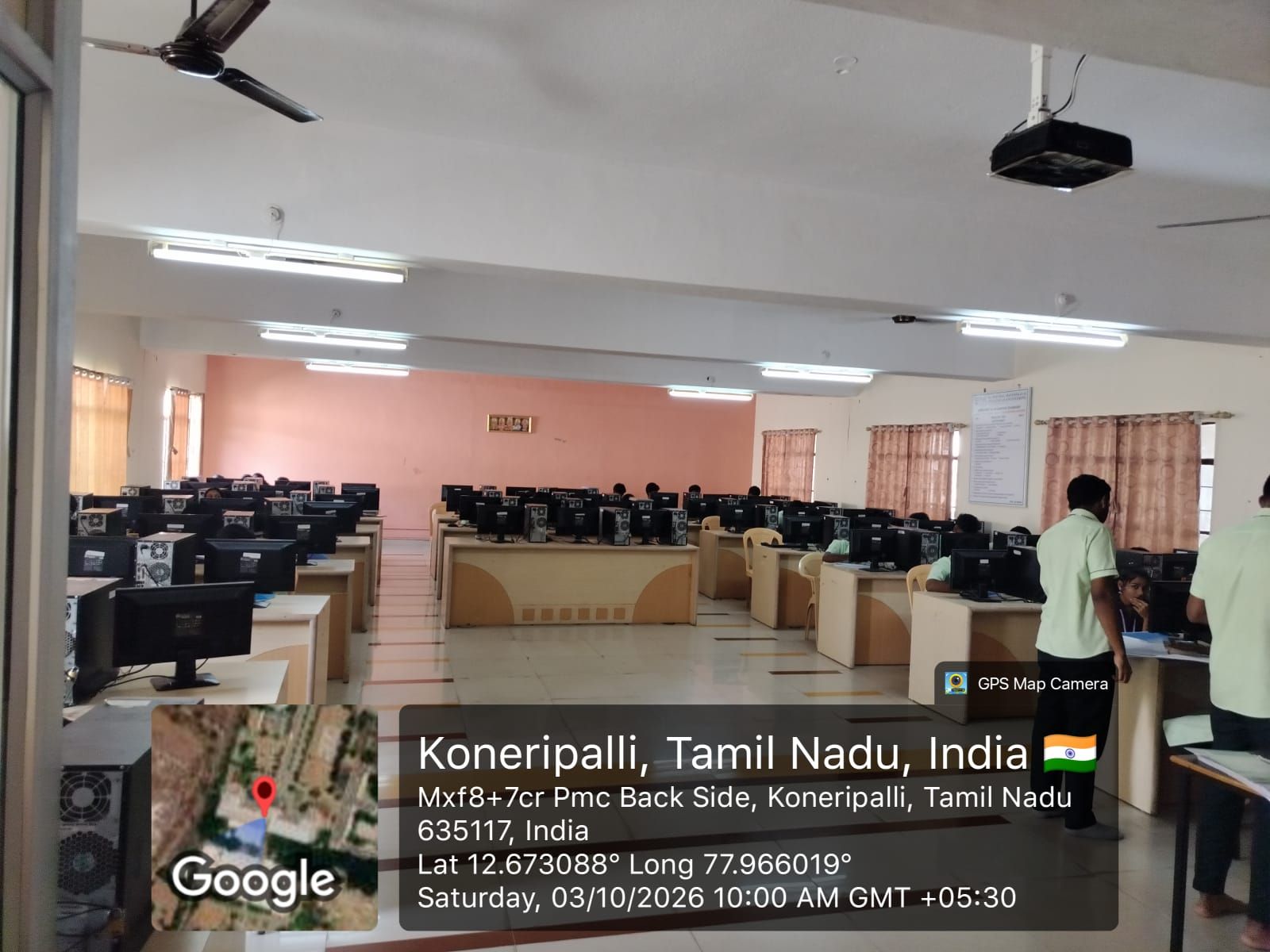 Data Science & Analytics Laboratory: rows of desktop computers on wooden benches in a large room, with students working at the nearer benches.