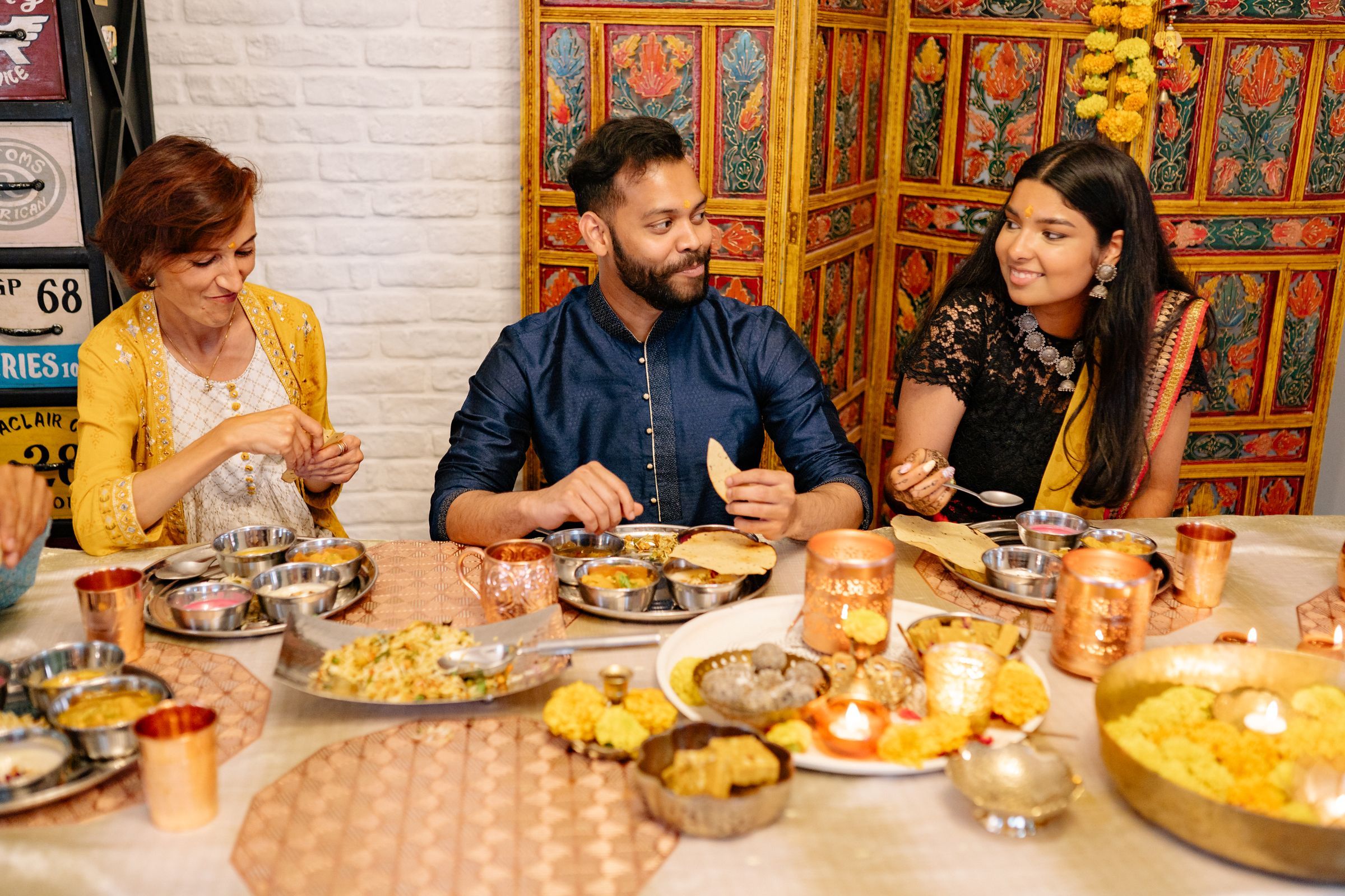 Friends sharing a festive meal of traditional dishes