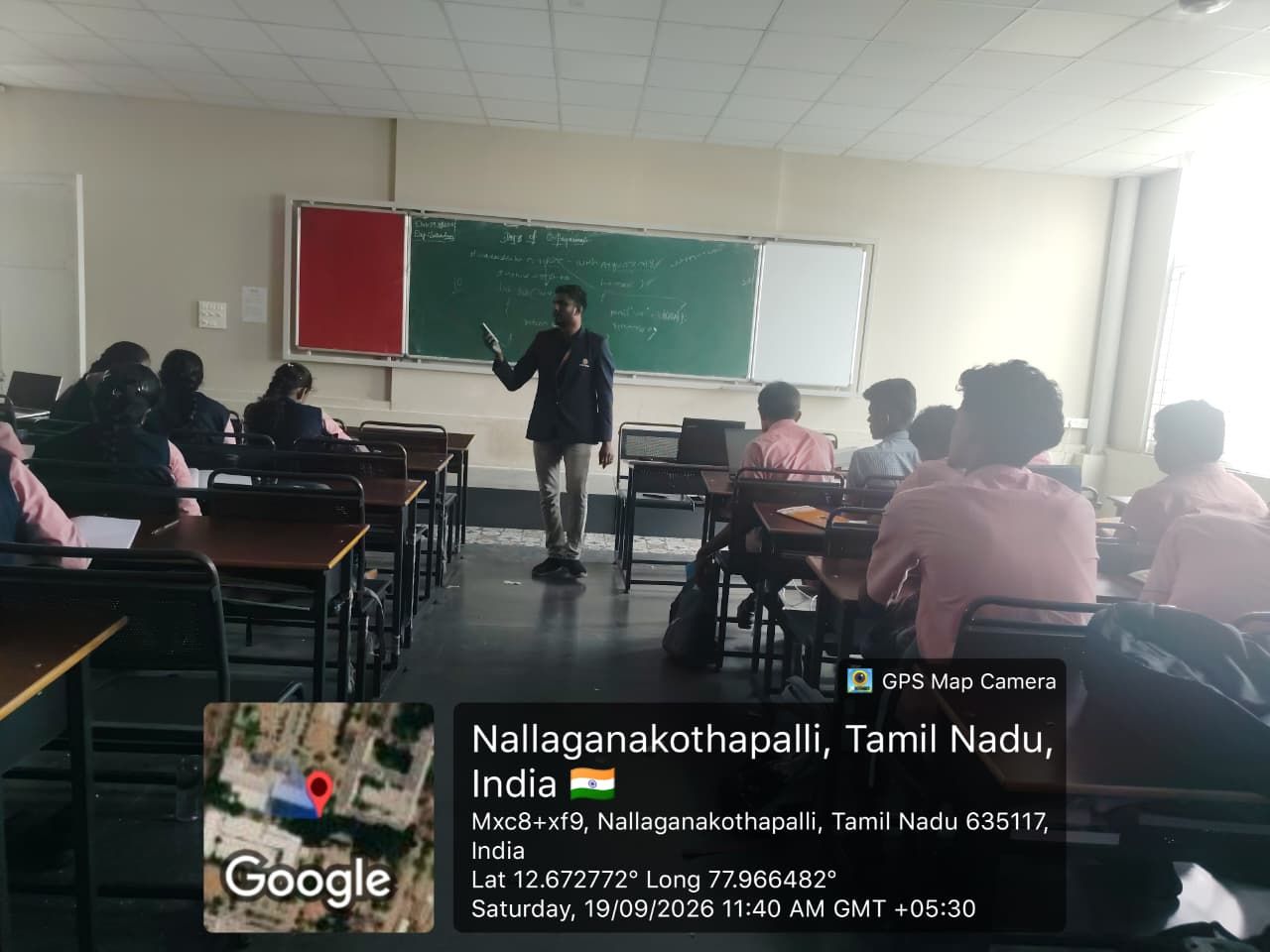 A trainer speaking to students in a classroom during the Skills and Brains soft skills training.